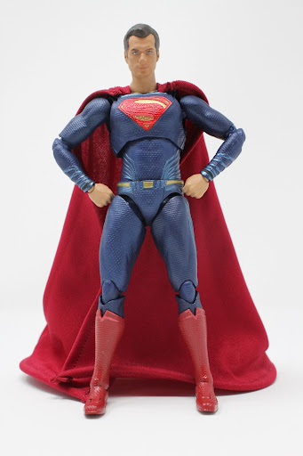 Superman cloaked in a jet-black Zacks Snyder-designed suit stands  heroically